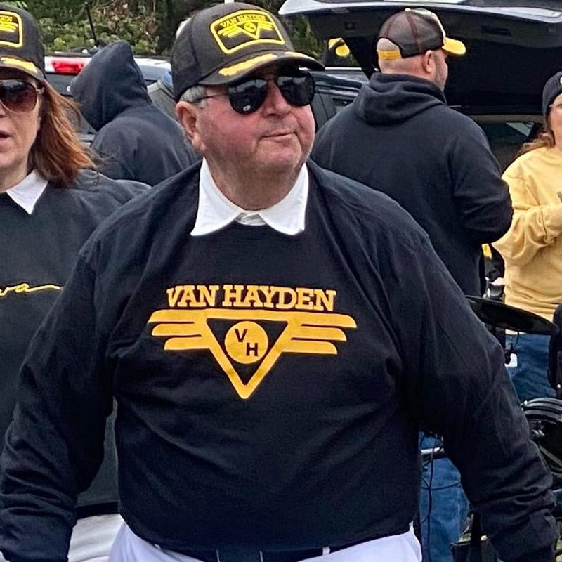 Opa Van Hayden wearing a black shirt with 'Van Hayden' logo at an Iowa tailgate